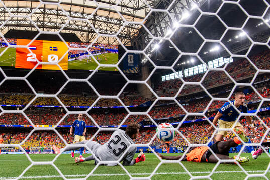 Cody Gakpo of Netherlands scores 3-0 behind goalkeeper