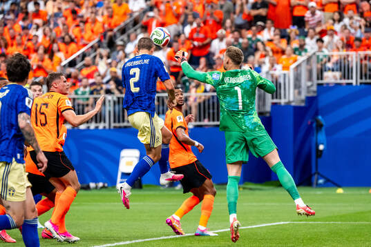 Gustaf Lagerbielke of Sweden scores 2-1 behind goalkeeper