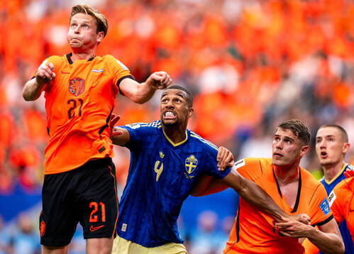 Isak Hien of Sweden against Frenkie De Jong and Micky Van