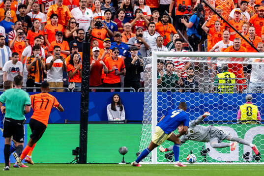 Cody Gakpo of Netherlands scores 4-0 behind goalkeeper