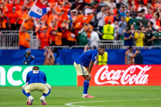 Gustaf Lagerbielke and Isak Hien of Sweden look dejected