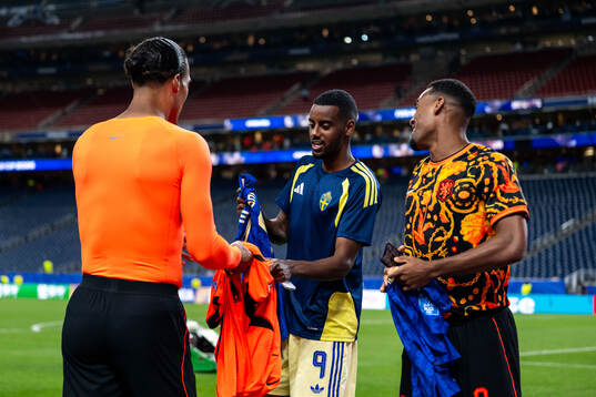 Alexander Isak of Sweden with Virgil Van Dijk and Ryan