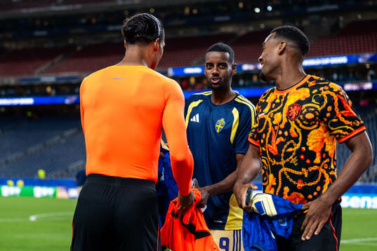 Alexander Isak of Sweden with Virgil Van Dijk and Ryan