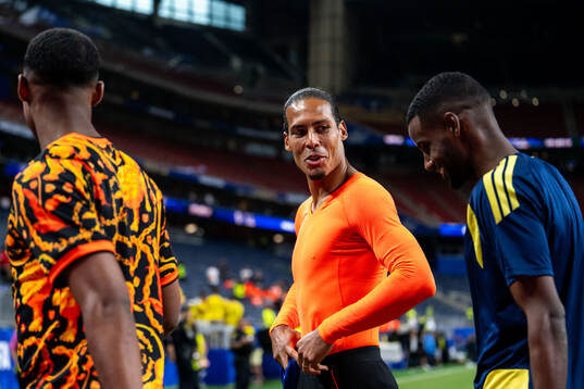 Alexander Isak of Sweden with Virgil Van Dijk and Ryan