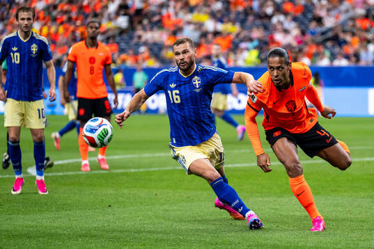 Jesper Karlström of Sweden and Virgil Van Dijk of
