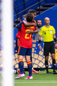 Lamine Yamal of Spain celebrates with Mikel Oyarzabal