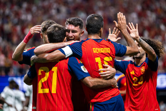Mikel Oyarzabal of Spain celebrates with team mates