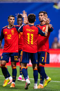 Ferran Torres of Spain celebrates with Pedro Porro and