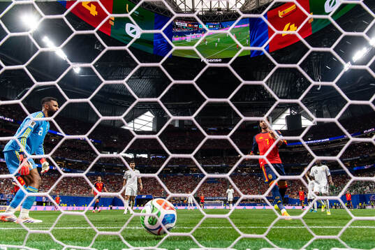 Ferran Torres of Spain scores 5-0 behind goalkeeper