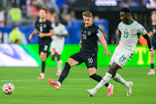 Martin Ødegaard of Norway and Moussa Niakhate of Senegal