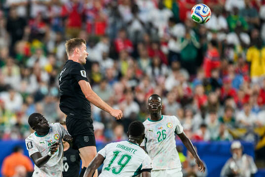 Alexander Sørloth of Norway and Pape Gueye of Senegal