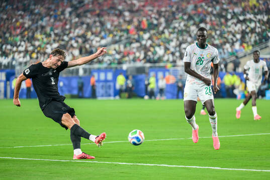 Sander Berge of Norway and Pape Gueye of Senegal