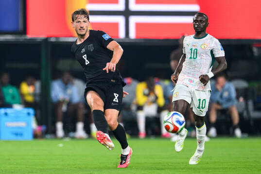 Sander Berge of Norway and Sadio Mane of Senegal