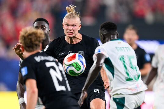 Erling Braut Haaland of Norway and Krepin Diatta of Senegal