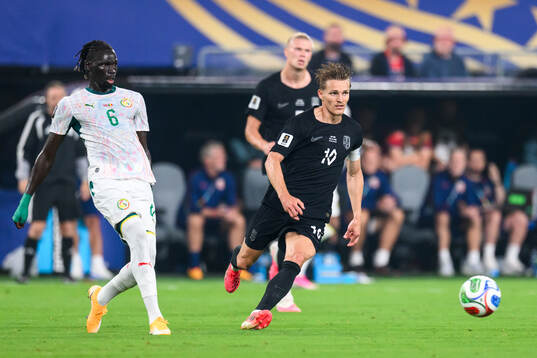 Pathe Ciss of Senegal and Martin Ødegaard of Norway