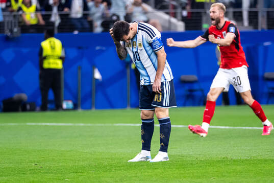 Lionel Messi of Argentina looks dejected