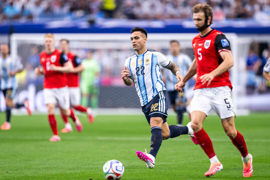Lautaro Martinez of Argentina and Stefan Posch of Austria