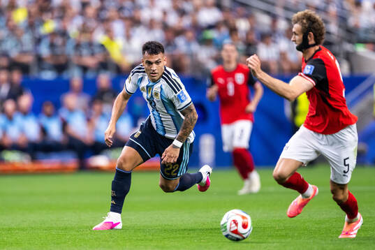 Lautaro Martinez of Argentina and Stefan Posch of Austria