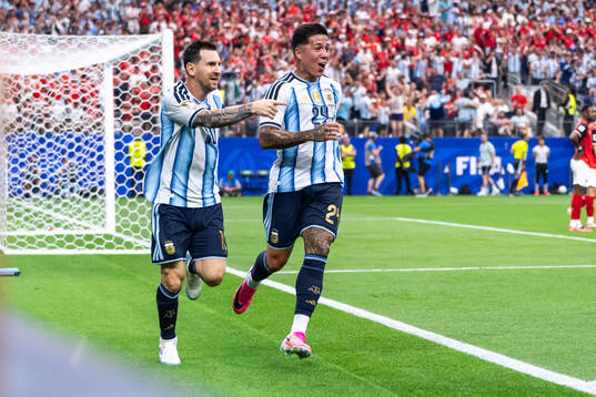 Lionel Messi of Argentina celebrates with Enzo Fernandez