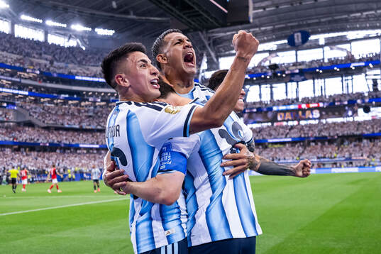 Lionel Messi of Argentina celebrates with Enzo Fernandez