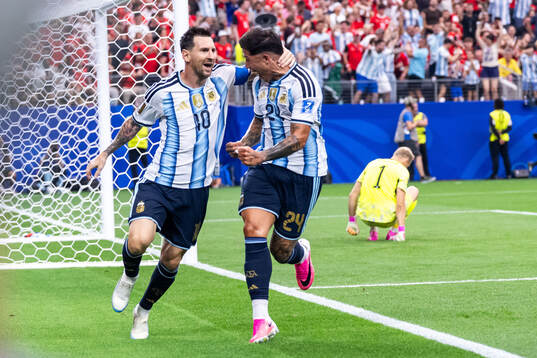 Lionel Messi of Argentina celebrates with Enzo Fernandez