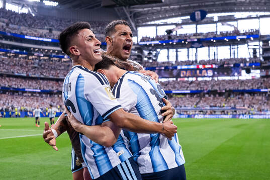 Lionel Messi of Argentina celebrates with Enzo Fernandez,