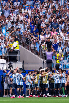 Lionel Messi of Argentina celebrates with team mates