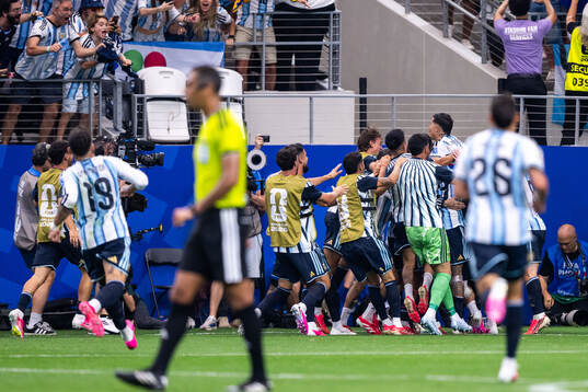 Lionel Messi of Argentina celebrates with team mates