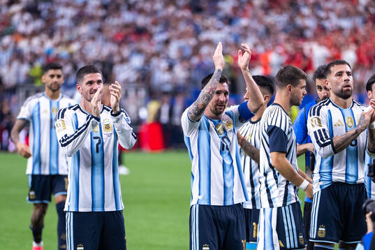 Rodrigo De Paul and Lionel Messi of Argentina
