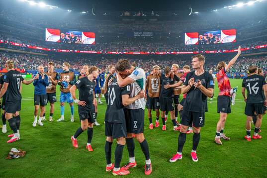 Martin Ødegaard and Sander Berge of Norway celebrate