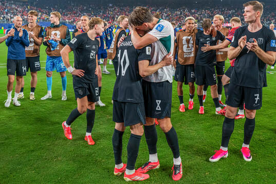 Martin Ødegaard and Sander Berge of Norway celebrate
