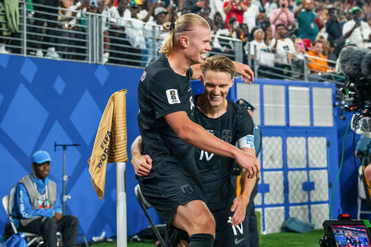 Erling Braut Haaland of Norway celebrates with teammate
