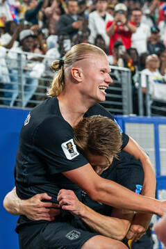 Erling Braut Haaland of Norway celebrates with teammate