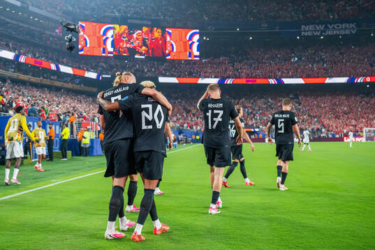 Erling Braut Haaland of Norway celebrates with teammate