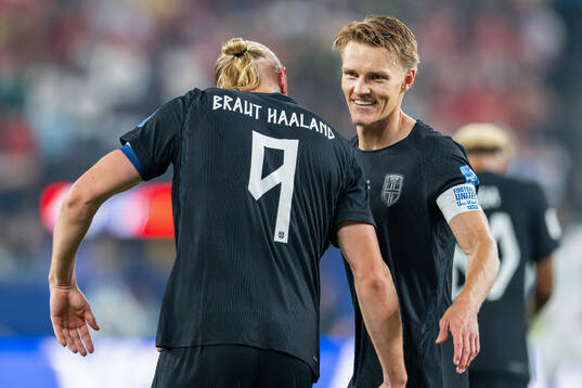 Erling Braut Haaland of Norway celebrates with teammate