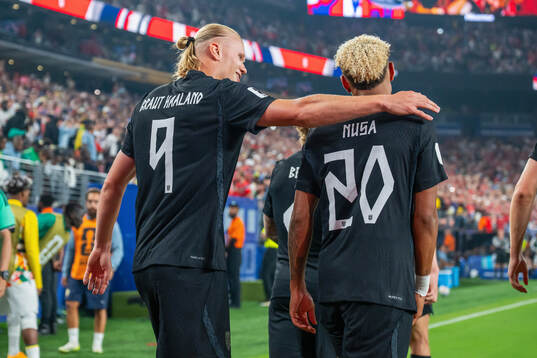 Erling Braut Haaland of Norway celebrates with teammate