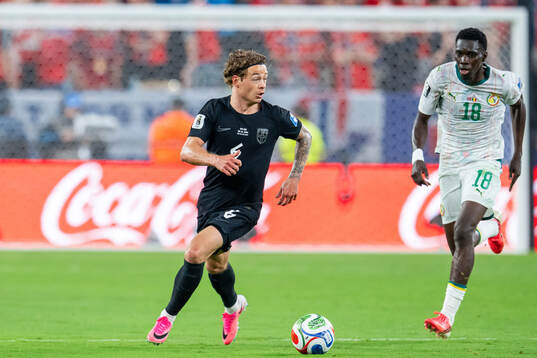 Patrick Berg of Norway and Ismaila Sarr of Senegal