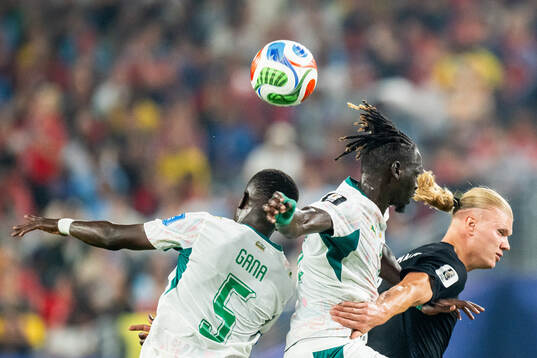 Idrissa Gana Gueye of Senegal and Erling Braut Haaland of