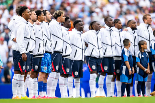 Ollie Watkins of England with team mates