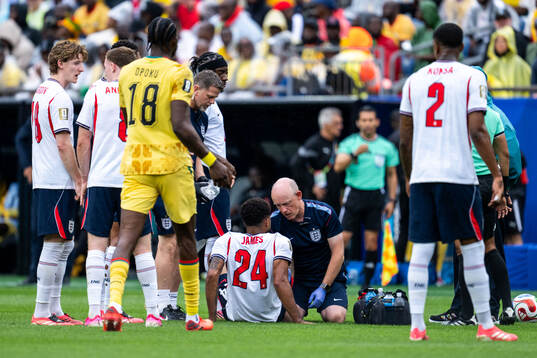Reece James of England receives medical attention