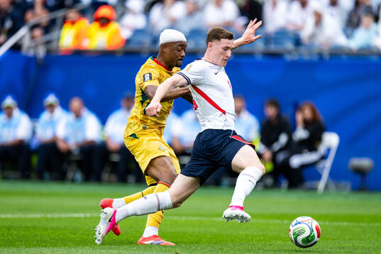 Jordan Ayew of Ghana and Elliot Anderson of England