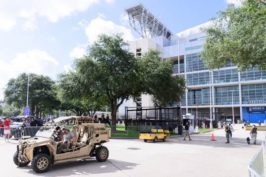 Security personel in a vehicle outside Houston Stadium