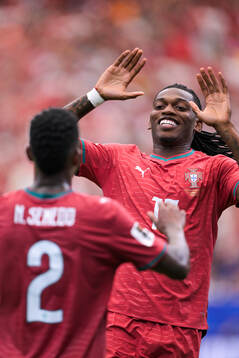 Rafael Leao and Nelson Semedo of Portugal celebrate