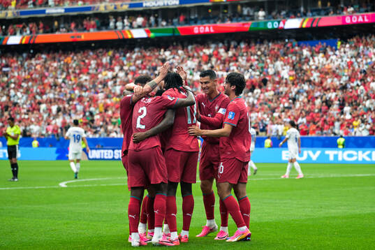Rafael Leao of Portugal celebrates with team mates