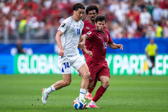 Eldor Shomurodov of Uzbekistan and Joao Neves of Portugal