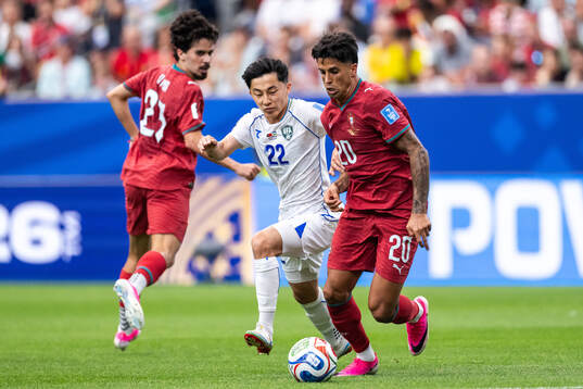 Abbosbek Fayzullaev of Uzbekistan and Joao Cancelo of