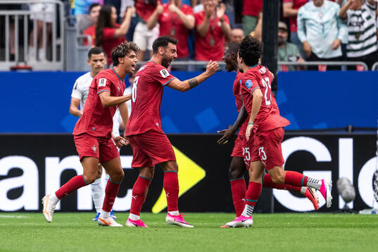 Nuno Mendes of Portugal celebrates with Joao Felix, Bruno