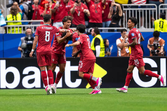 Nuno Mendes of Portugal celebrates with Joao Felix, Bruno