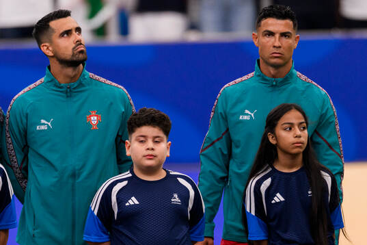 Goalkeeper Diogo Costa and Cristiano Ronaldo of Portugal