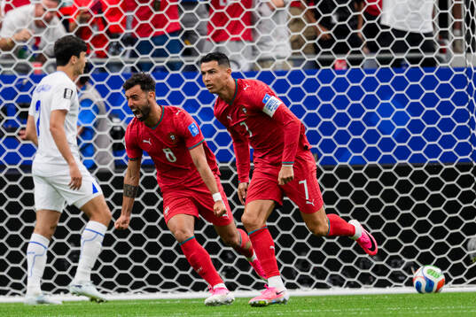 Bruno Fernandes and Cristiano Ronaldo of Portugal celebrate